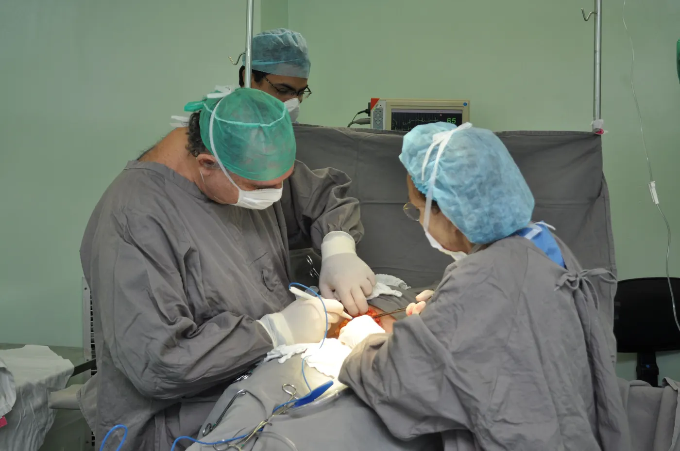Surgeons operating in the theatre at Capital International Hospital